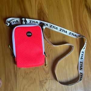Zyia Active hot pink convertible textured phone crossbody or waist bag.